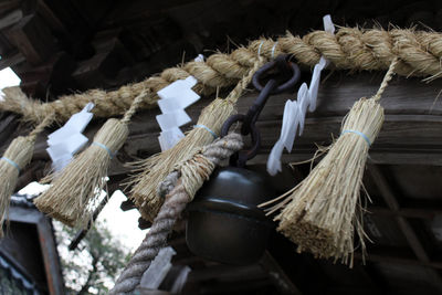 Low angle view of tied hanging from roof