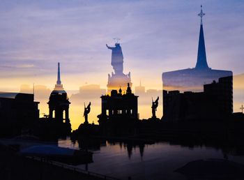 Silhouette of building against sky during sunset