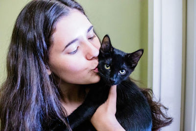 Portrait of woman with cat