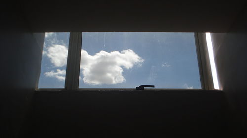 Low angle view of sky seen through window