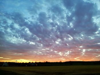 Scenic view of dramatic sky over land