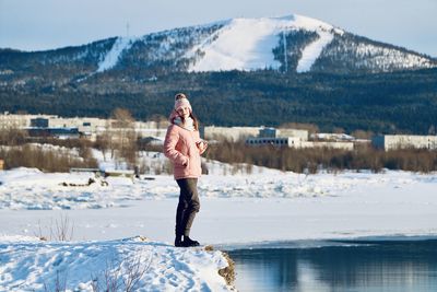 Full length of man standing in snow