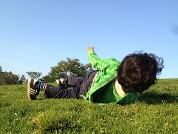 Man relaxing on grassy field