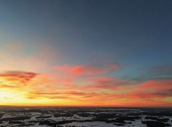 Scenic view of sea against romantic sky at sunset