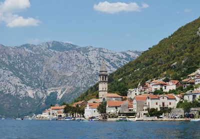 Kotor town by sea against mountains