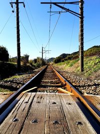 Electricity pylons over railway tracks