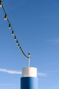 Low angle view of communications tower against sky