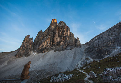 Rock formations in mountains against sky