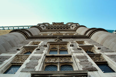 Low angle view of historical building against blue sky