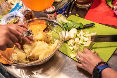 High angle view of woman preparing food on table