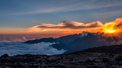 Scenic view of mountains against sky during sunset