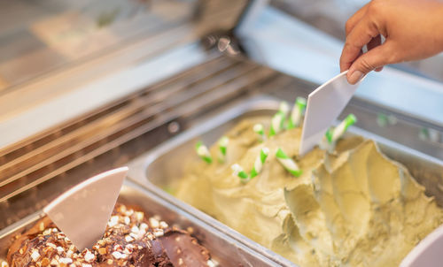 Close-up of hand holding ice cream