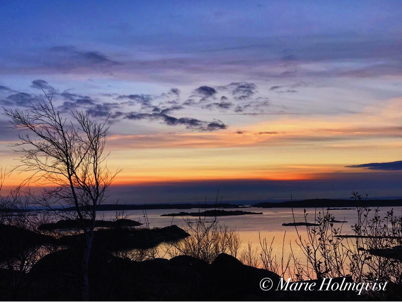 SCENIC VIEW OF SUNSET OVER SEA