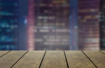 Close-up of empty wooden floor in building