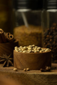 Close-up of roasted coffee beans on table