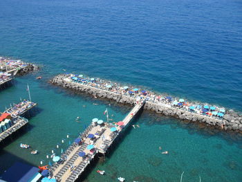 High angle view of sailboats at harbor