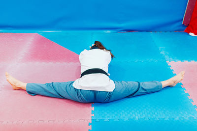 Full length of man lying on swimming pool