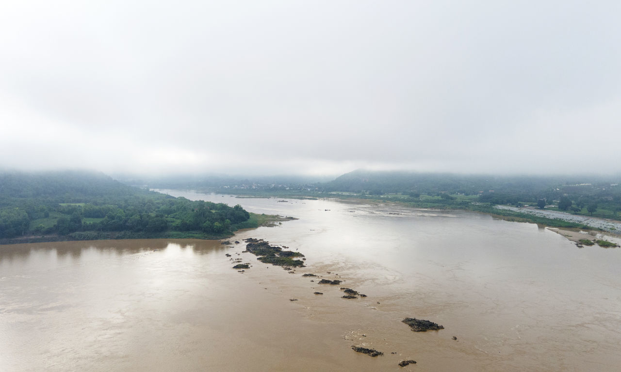 SCENIC VIEW OF SEA BY FOG AGAINST SKY