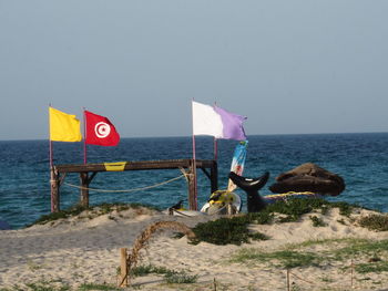 Lifeguard hut on beach against clear sky