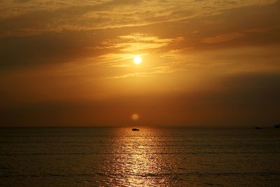 Scenic view of sea at sunset