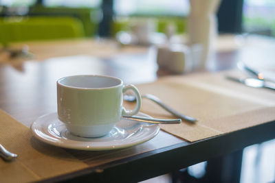 Close-up of coffee cup on table