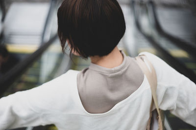 Rear view of woman standing outdoors