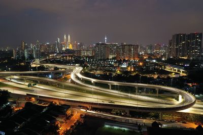 High angle view of illuminated buildings in city at night