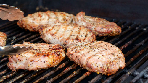 Close-up of meat on barbecue grill