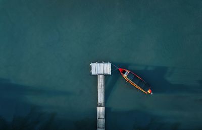 Aerial view of fishing boat by pier