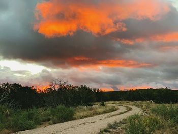 Scenic view of field against sky during sunset