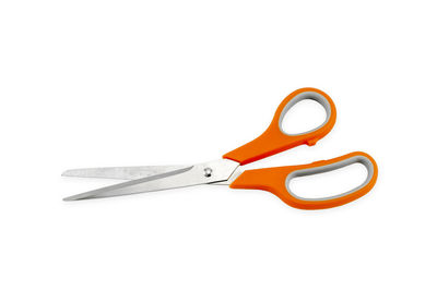 Close-up of scissors over white background