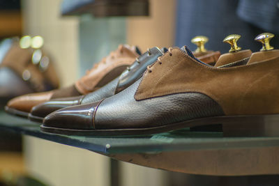 Close-up of shoes on shelf at store