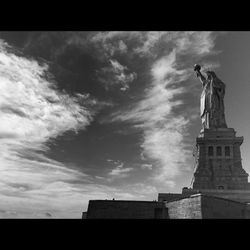 Low angle view of statue against cloudy sky