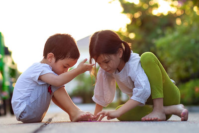 Children and girl looking away outdoors