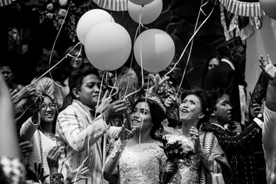 High angle view of people looking at balloons