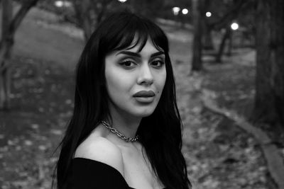 Portrait of young woman looking away