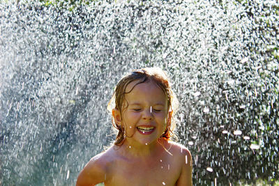 Portrait of smiling boy in water