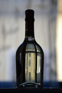 Close-up of beer glass bottle on table