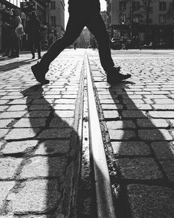 Low section of people walking in city