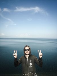 Portrait of man in sea against sky