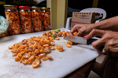 Midsection of man preparing food