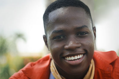 Close-up portrait of smiling young man