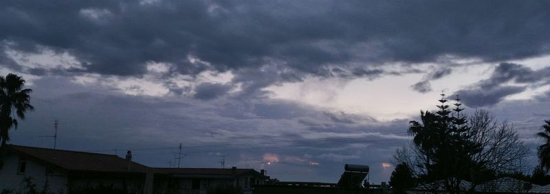 Storm clouds over houses