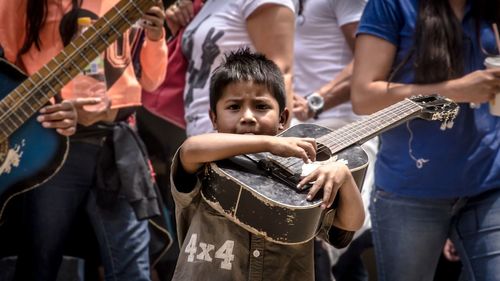 People playing guitar