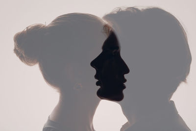 Close-up of woman against white background