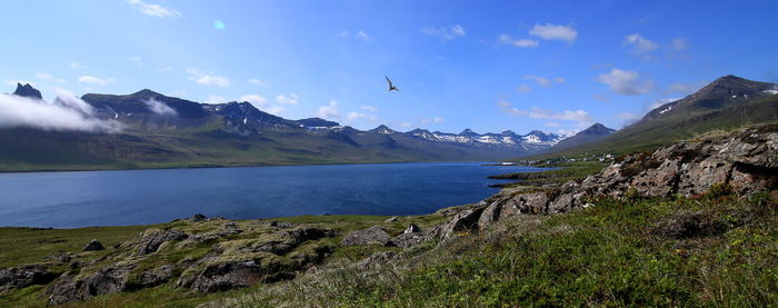 Scenic view of lake with mountains in background