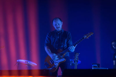 Low angle view of man playing guitar