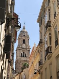 Low angle view of buildings against sky in city