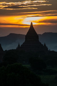 Stupa silhouette at sunset in the flat of bagan
