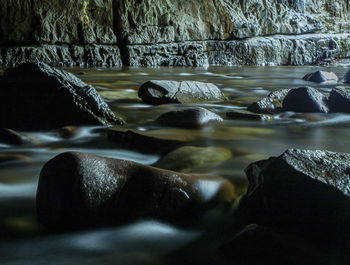 Close-up of water flowing through rocks